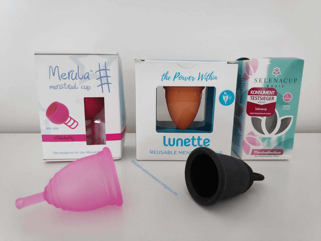 Menstruationstassen und Verpackung